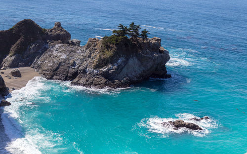 High angle view of rock in sea