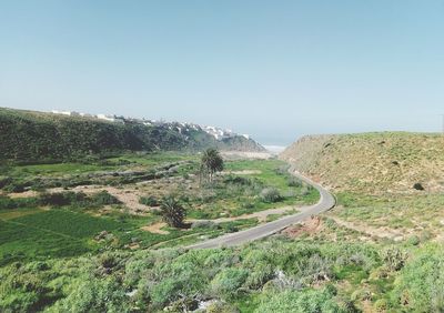 Scenic view of landscape against clear blue sky