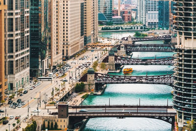 High angle view of bridges and buildings in city