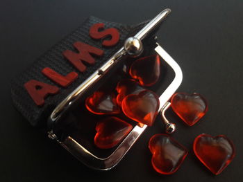 Close-up of headphones on table against black background