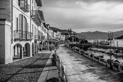 Street amidst buildings against sky