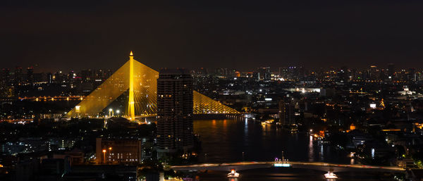 Banner of citiscape of bangkok, thailand at night with view of rama viii bridge