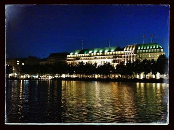 Reflection of illuminated buildings in water