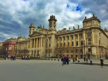 Low angle view of historical building against cloudy sky