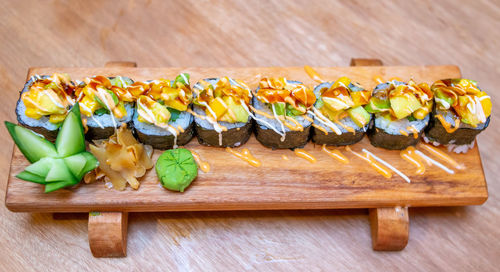 High angle view of sushi on cutting board