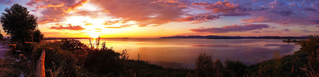 Scenic view of sea against romantic sky at sunset