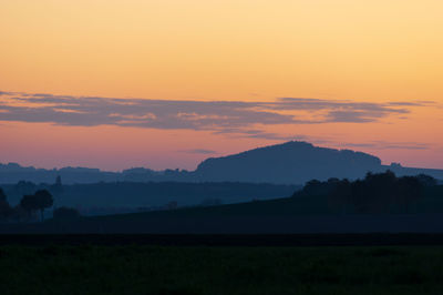 Scenic view of silhouette landscape against sky during sunset