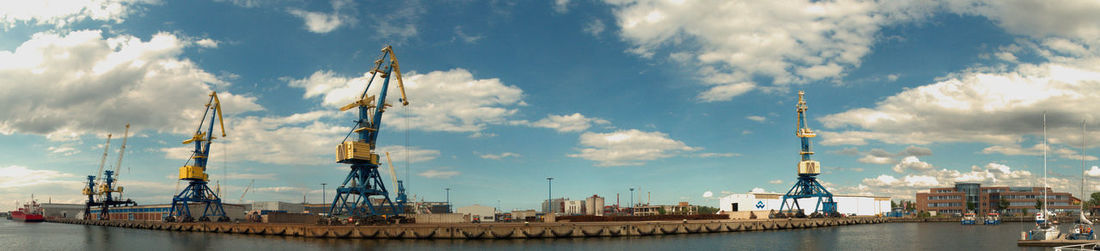 View of harbor against cloudy sky