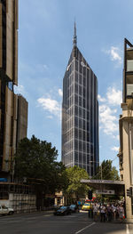 Modern buildings in city against sky