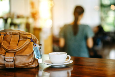 Coffee cup on table at cafe