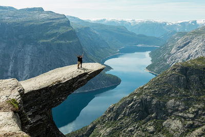 Scenic view of mountains by cliff