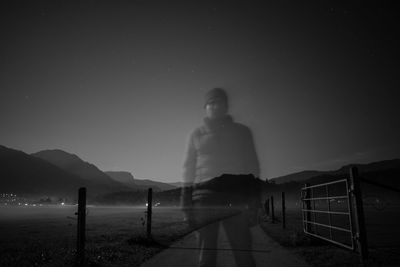 Man on road at night