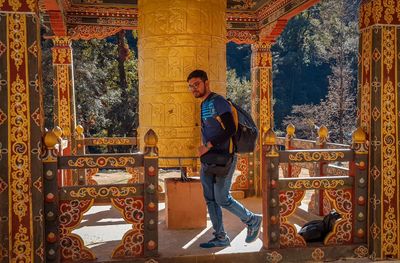 Full length of young man against temple building