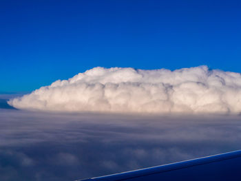 Low angle view of airplane flying in sky