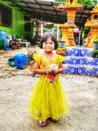 Portrait of cute girl standing outdoors