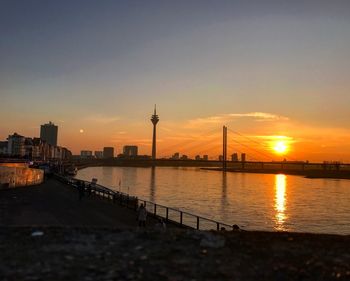 View of bridge over river during sunset