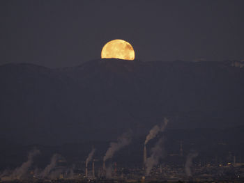 View of factory against sky at night