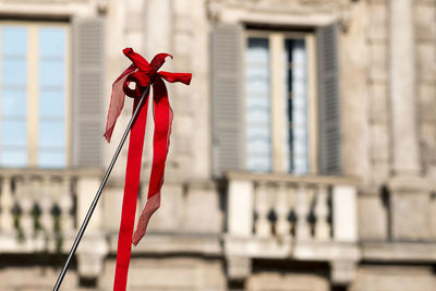 Close-up of red ribbon on metal stick