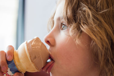 Close-up of girl eating ice cream