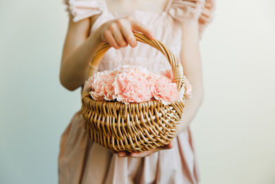 Midsection of woman holding bag