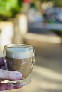 Close-up of hand holding drink