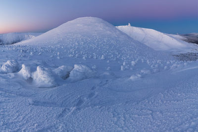 Snow covered mountain against sky