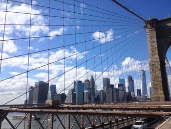 Modern buildings against cloudy sky