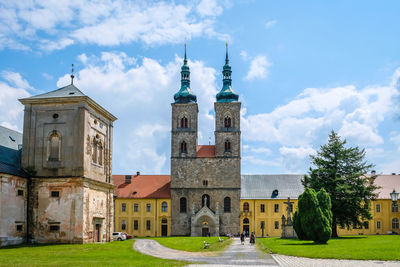 Church amidst buildings against sky