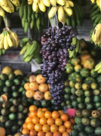 Close-up of grapes hanging in market stall