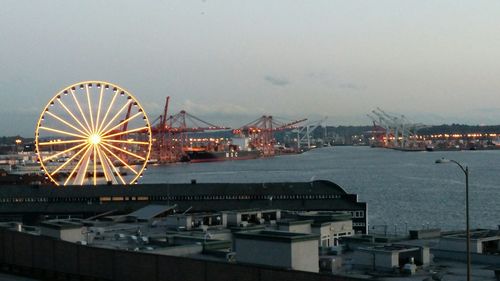 Illuminated ferris wheel at night