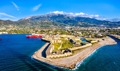 Aerial view of sea and buildings in city