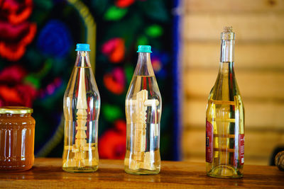 Close-up of wine bottles on table