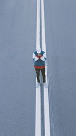 High angle view of person standing on road in winter