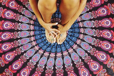 Low section of woman sitting on floor