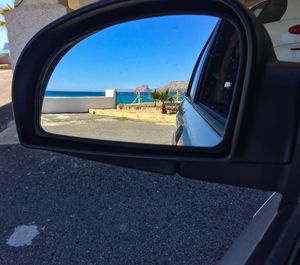 Close-up of car on road