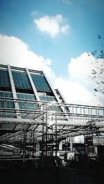 Low angle view of building against cloudy sky