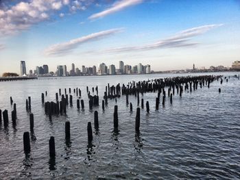 View of wooden posts in sea