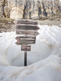 Text on snow covered rock