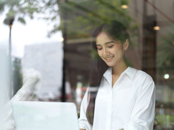 Young businesswoman working on laptop at office