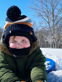Portrait of smiling boy in snow