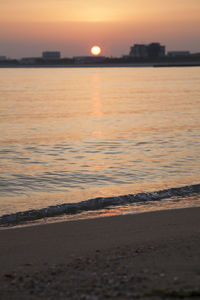 Scenic view of sea against romantic sky at sunset