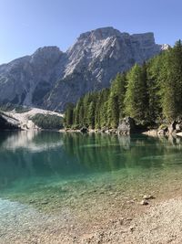 Scenic view of lake and mountains against sky