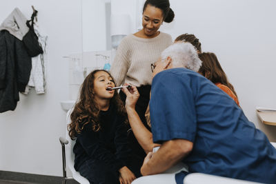 Parents with daughter in doctors office