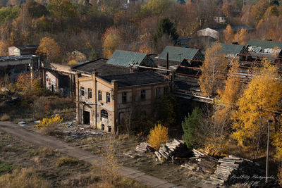 High angle view of trees and buildings in city