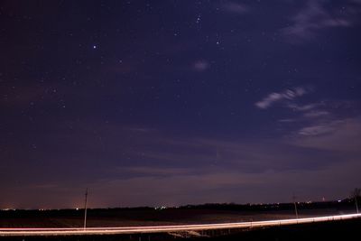 Scenic view of landscape against sky at night