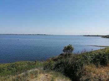 Scenic view of sea against clear sky
