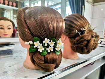 Rear view of woman with potted plant
