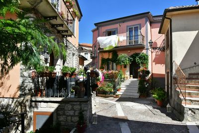 A narrow street among the old houses of greci, a village in the campania region, italy.