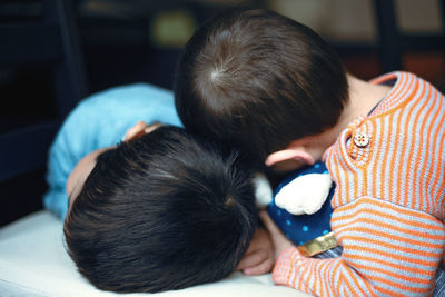 Rear view of mother and son