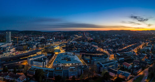 High angle view of city lit up at dusk